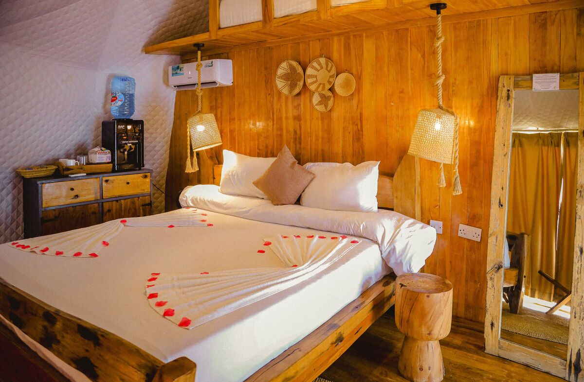 Inside a dome — Beds, headboards and the wood-and-canvas interiors of the domes, tent by tent.